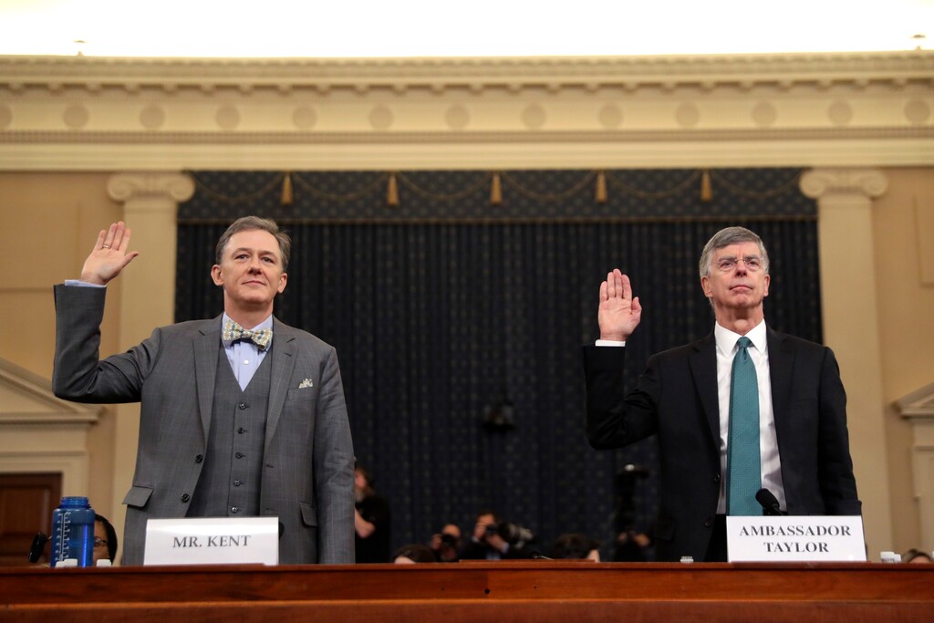 (Andrew Harnik | AP) Career Foreign Service officer George Kent and top U.S. diplomat in Ukraine William Taylor, right, are sworn in to testify during the first public impeachment hearing of the House Intelligence Committee on Capitol Hill, Wednesday Nov. 13, 2019 in Washington.
