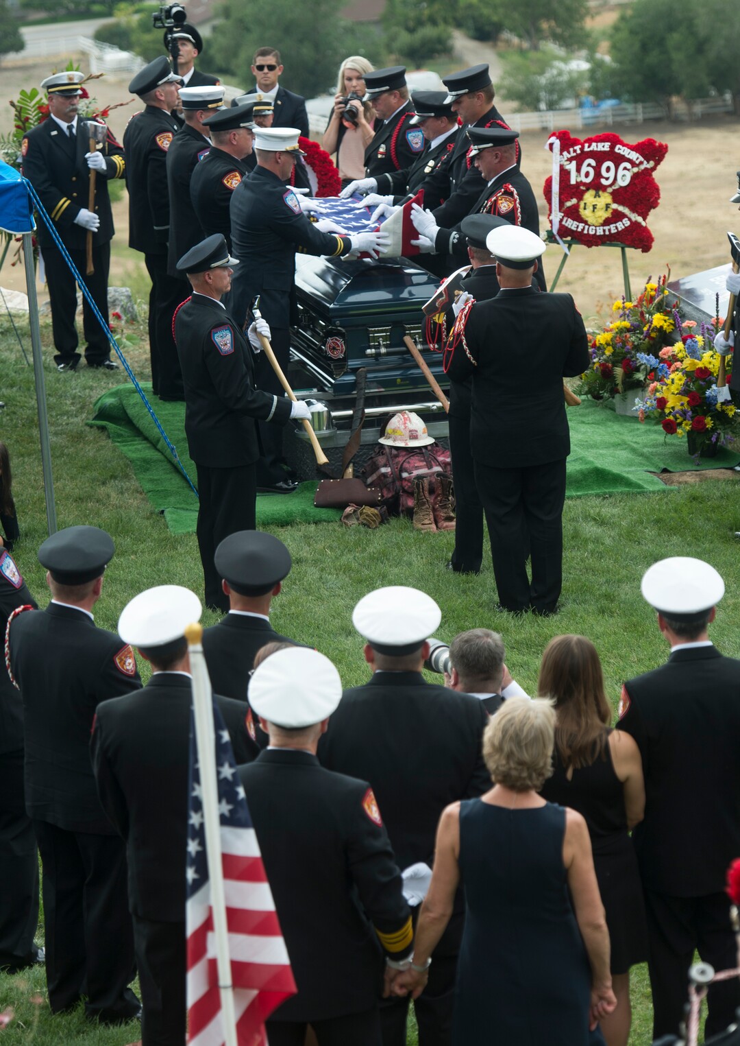 (Rick Egan  |  The Salt Lake Tribune)  The flag on the casket of Matthew Burchett is folded by the pall bearers at East Lawn Memorial Hills Cemetery in Provo, Monday, Aug. 20, 2018.