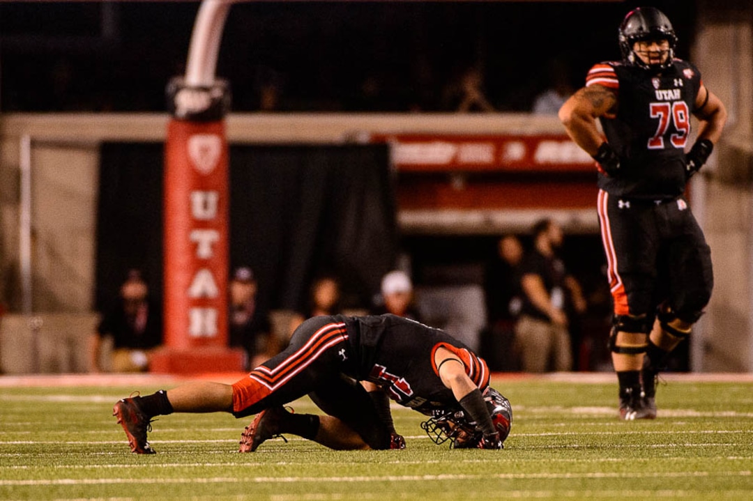 (Trent Nelson | The Salt Lake Tribune)  Utah Utes wide receiver Britain Covey (18) after a hard hit by Washington Huskies defensive back Byron Murphy (1) as the University of Utah hosts Washington at Rice-Eccles Stadium in Salt Lake City, Saturday Sept. 15, 2018.
