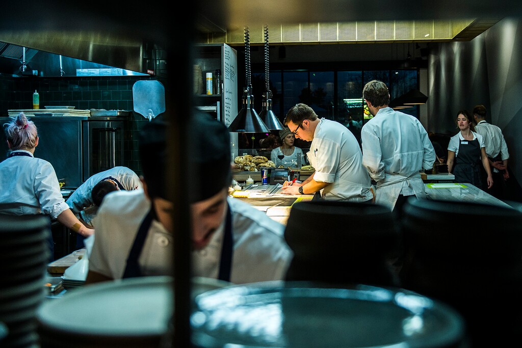 ( Chris Detrick  |  The Salt Lake Tribune file photo ) Chef and co-owner Mike Blocher, center, works in the kitchen at Table X in 2017. The restaurant will offer a seven-course tasting menu featuring modern cuisine for Valentine's Day diners.