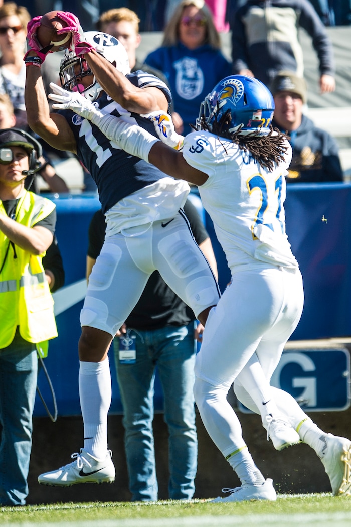 (Chris Detrick  |  The Salt Lake Tribune)  Brigham Young Cougars wide receiver Micah Simon (13) makes a touchdown catch past San Jose State Spartans cornerback Andre Chachere (21) during the game at LaVell Edwards Stadium Saturday, October 28, 2017.  