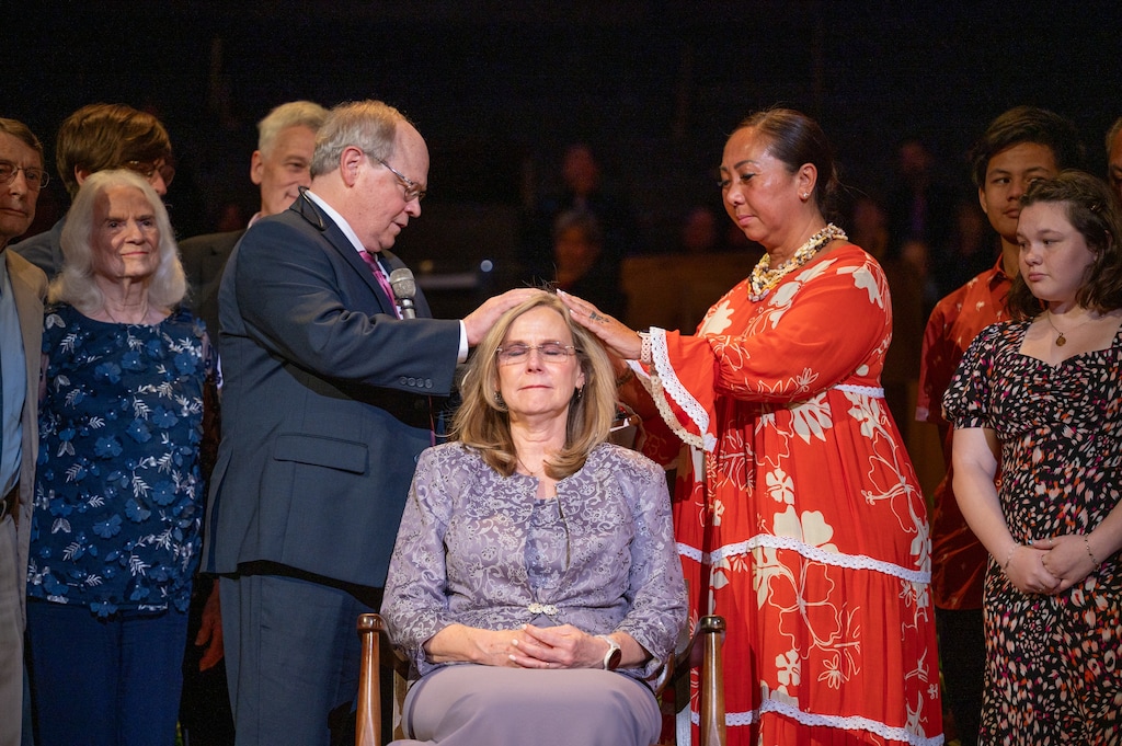 (Lyle R. Anderson II via Community of Christ) Prophet-President Stassi Cramm, center, is ordained Sunday, June 1,2025, to lead Community of Christ by President Emeritus Steve Veazey, left, and Mareva Arnaud Tchong, president of the Council of Twelve Apostles.