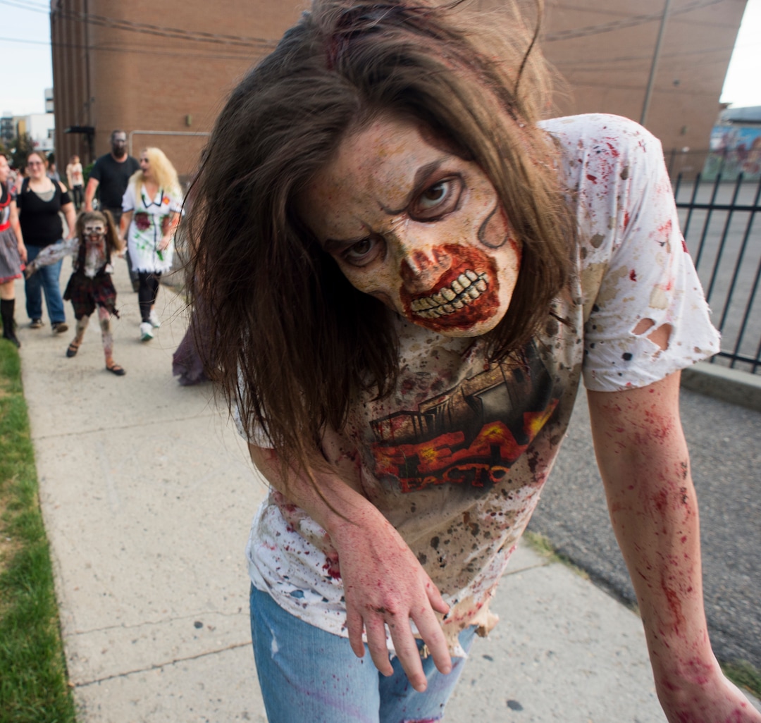(Rick Egan  |  The Salt Lake Tribune)       Tayler Morgan walks the streets as a zombie during the 11th annual Salt Lake Zombie Walk, Sunday, Aug. 26, 2018.