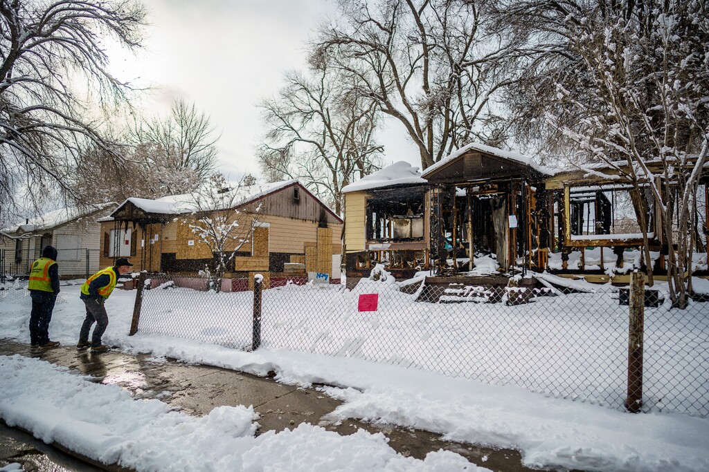 (Trent Nelson | The Salt Lake Tribune) Four homes in the Ballpark neighborhood were posted with an order for emergency demolition on Tuesday, Dec. 13, 2022, after a series of recent fires.