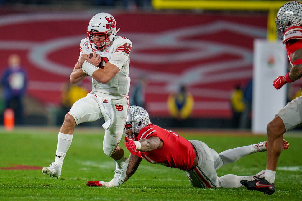 (Trent Nelson  |  The Salt Lake Tribune) Utah Utes quarterback Bryson Barnes (16) runs for a first down, as the Utah Utes face the Ohio State Buckeyes at the Rose Bowl in Pasadena, Calif., on Saturday, Jan. 1, 2022.