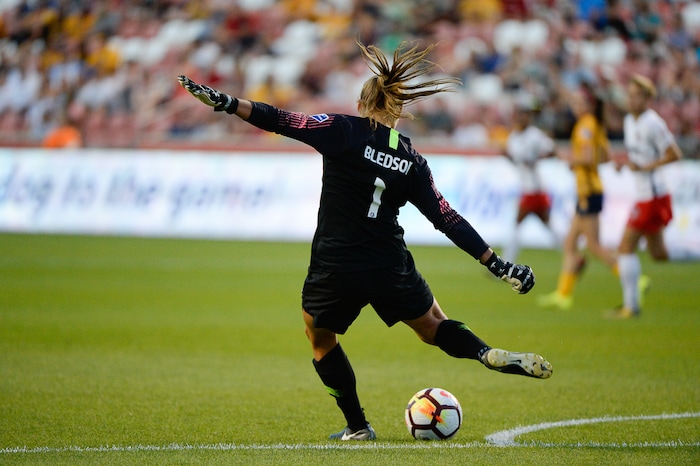 (Francisco Kjolseth  |  The Salt Lake Tribune)  Utah Royals FC hosts Washington Spirit, NWSL soccer at Rio Tinto Stadium in Sandy, Wed. Aug. 8, 2018. Washington Spirit goalkeeper Aubrey Bledsoe (1) launches a midfield shot during the first half of the game. 