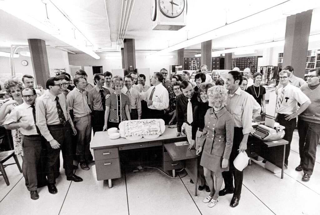 April 15, 1971 Tribune Centennial W/cake provided by KSL-TV.Left to Right:1st Row - Earl Conrad, Mike Korologos, John Waldo, Alan Halliday Shirley Jones, Lance Gudmundsen, John W. Gallivan (with knife), Leah Beckstead, Harry Fuller, JoAnn Jacobsen, Bernie Moss, Hank McKee (behind Bernie)Last Row - Patti Fonnesbeck, Terry Newfarmer, Richard Rosetta, Lee, Hinkins, Gerald Cunningham (behind Lance), Keith Otteson, George Sorensen, Patricia McCoy (with headband), Frank Brunsman, Barbi Ellefsen, Harold Schindler (behind Barbi), Dennis Green, Roy Hudson (behind Hank), Will Fehr (behind Roy), Susan Dudley (with beads), Ross Welser, Marion Dunn.