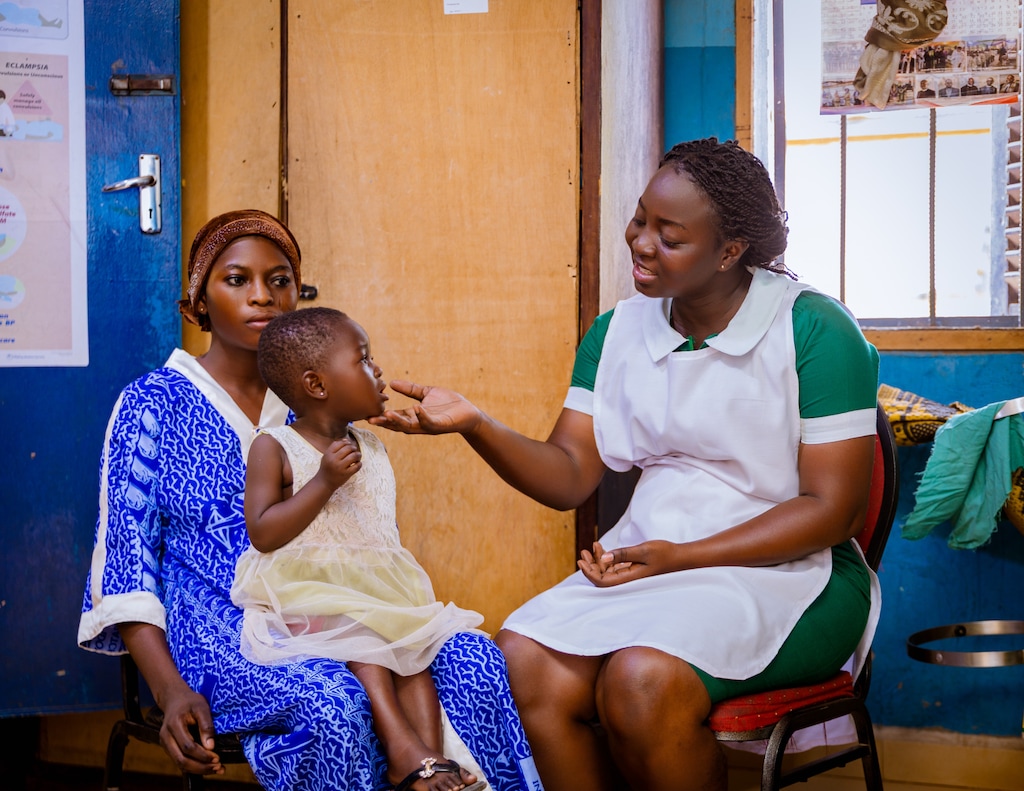 (The Church of Jesus Christ of Latter-day Saints) Leila Salifu, right, a midwife at the Langbinsi Health Center in Ghana, cares for a mother and her child.