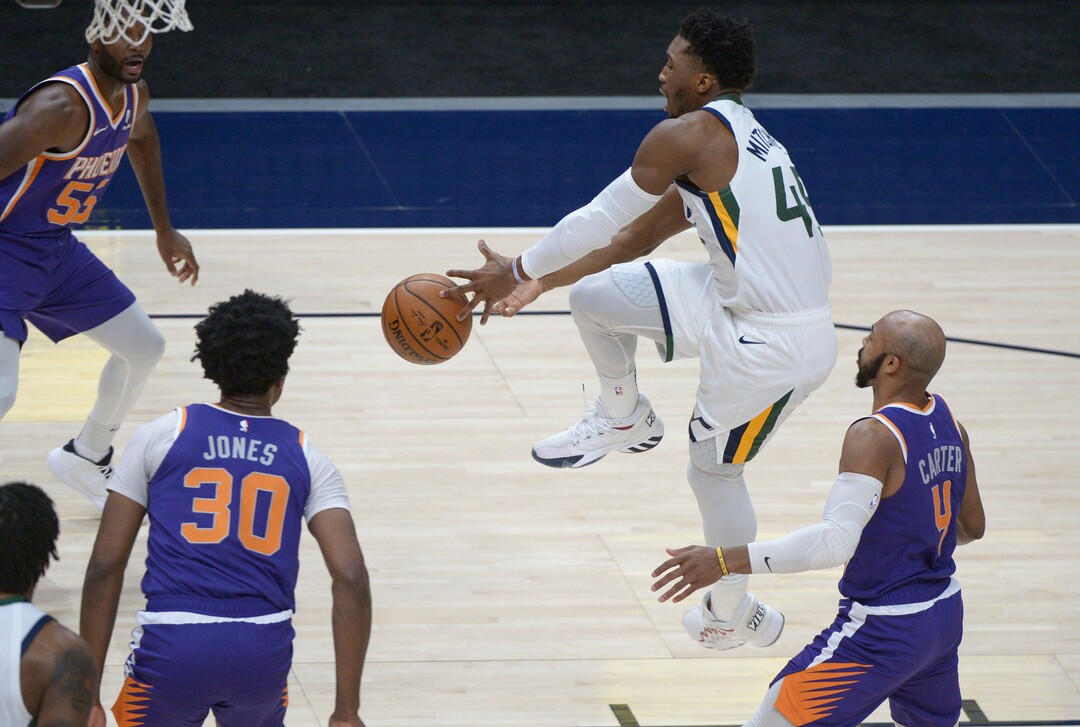 (Leah Hogsten  |  The Salt Lake Tribune) Utah Jazz guard Donovan Mitchell (45) loses control of the ball as the Jazz crack open their 2020-21 preseason with their second game against the Phoenix Suns, Dec. 14, 2020.