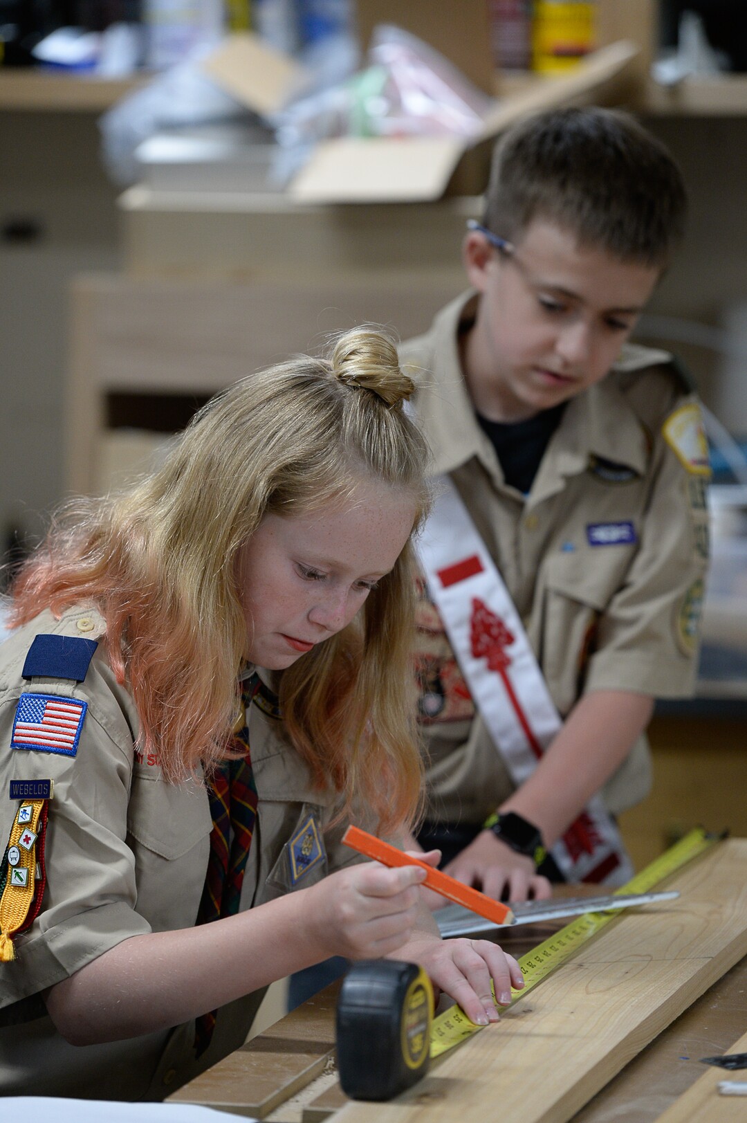 (Francisco Kjolseth  |  The Salt Lake Tribune)  Miriam Cook helps her brother Kolbie with his Eagle Scout project as they assemble bird houses in the family garage in Tooele on Monday, May 14, 2018. Miriam who is one of the early adopters into the Cub Scouts has always been interested in the things her brother did in scouts and has a goal of reaching her Arrow of Light rank. 