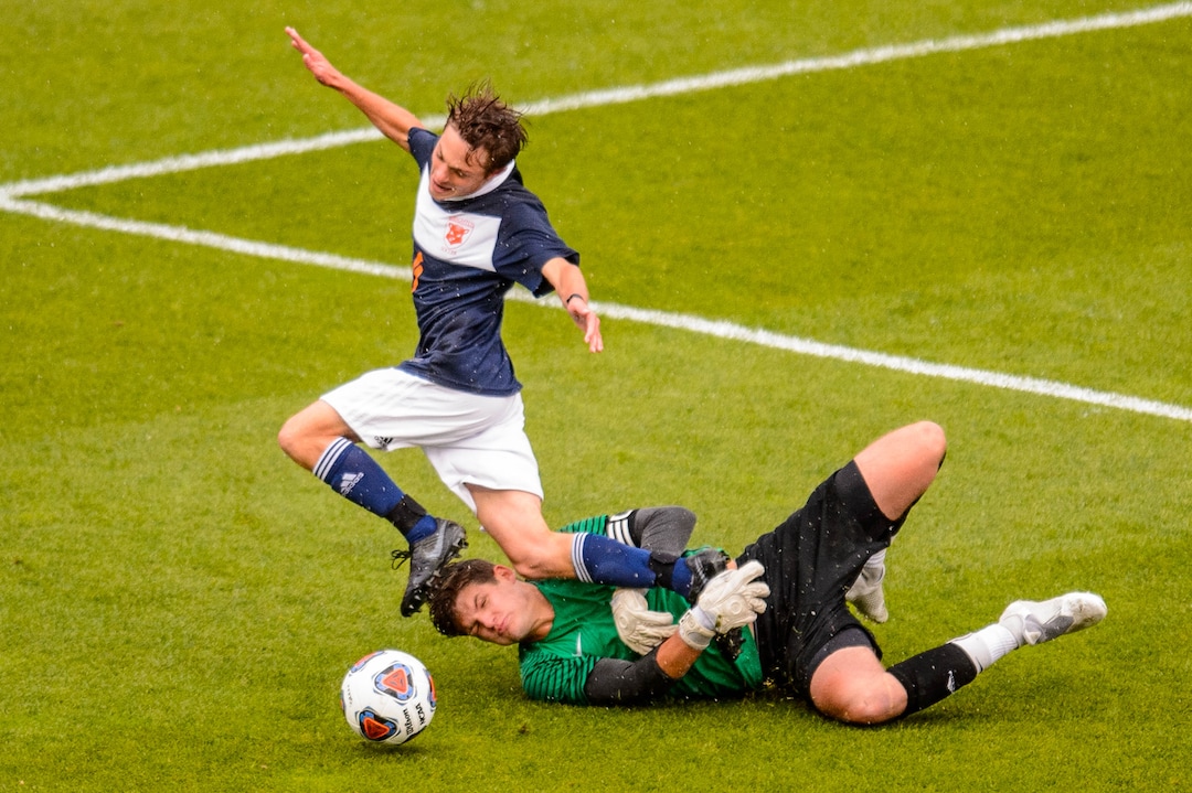 (Trent Nelson  |  The Salt Lake Tribune)  Olympus's Ian Jones (1) fouls Brighton's Brennan Neeley (10), setting up a penalty kick and score as Brighton defeats Olympus High School 3-2 in overtime in the 5A boys state championship game at Rio Tinto Stadium in Sandy, Thursday May 23, 2019.