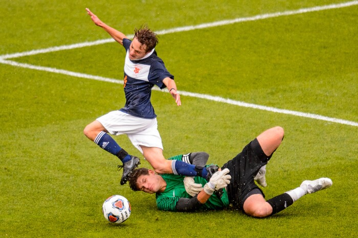 (Trent Nelson  |  The Salt Lake Tribune)  
Olympus's Ian Jones (1) fouls Brighton's Brennan Neeley (10), setting up a penalty kick and score as Brighton defeats Olympus High School 3-2 in overtime in the 5A boys state championship game at Rio Tinto Stadium in Sandy, Thursday May 23, 2019.