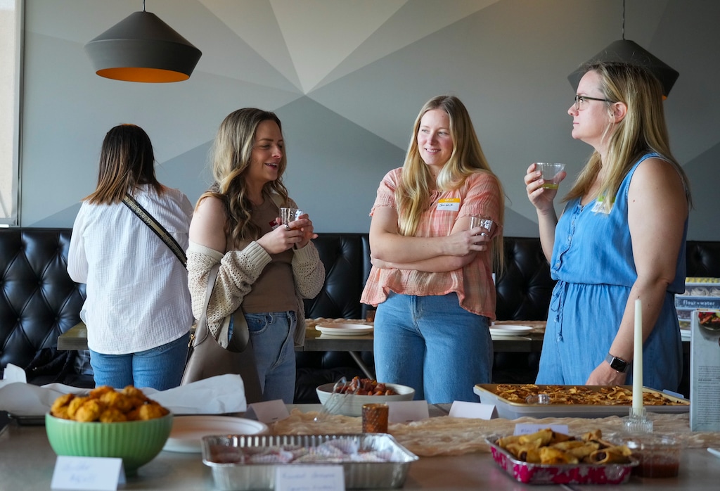 (Bethany Baker  |  The Salt Lake Tribune) Women gather during a cookbook club at Table X in Salt Lake City on Sunday, March 23, 2025.