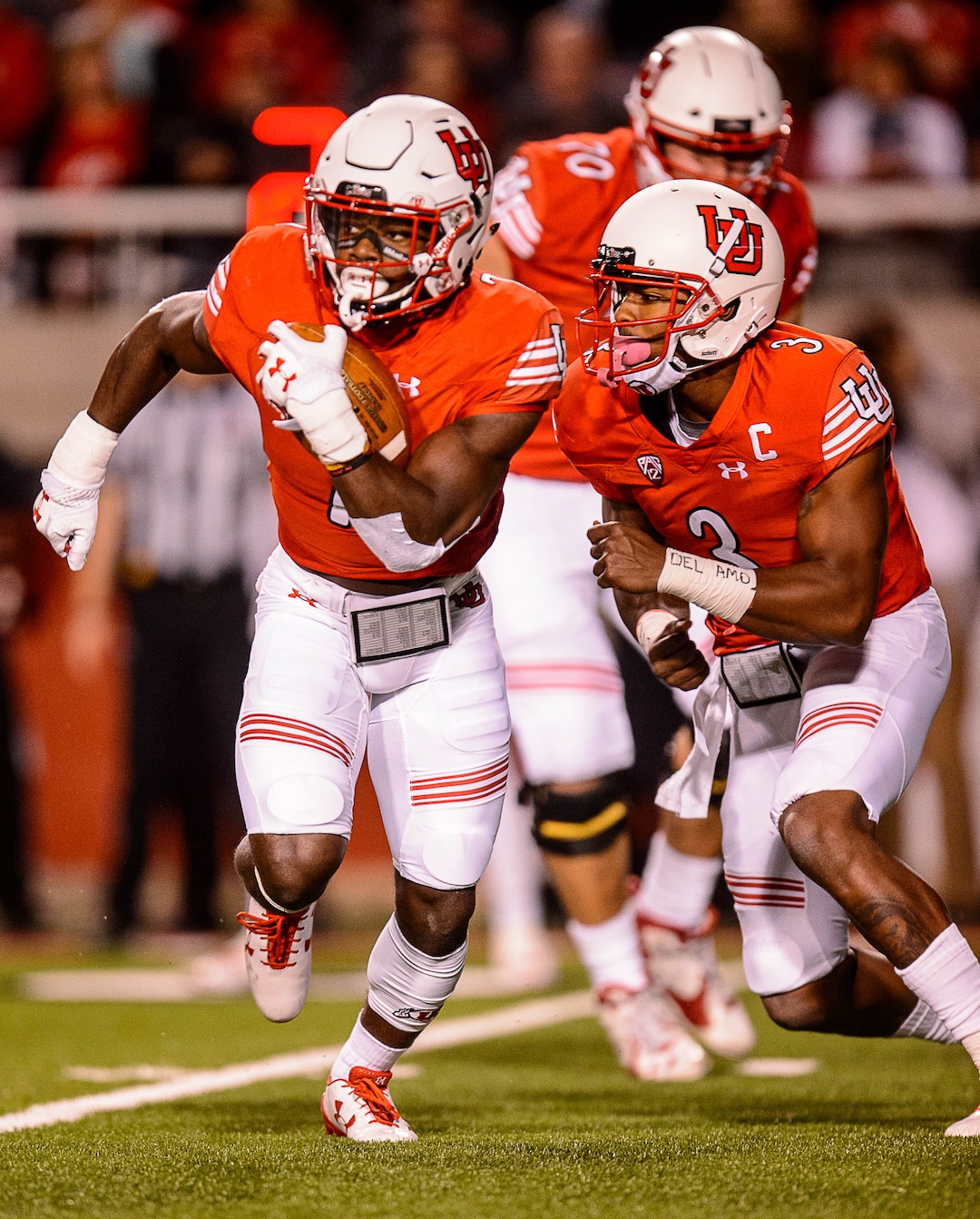 (Trent Nelson | The Salt Lake Tribune)  Utah Utes quarterback Troy Williams (3) hands off to Utah Utes running back Zack Moss (2) as the University of Utah hosts Stanford, NCAA football at Rice-Eccles Stadium in Salt Lake City Saturday October 7, 2017.