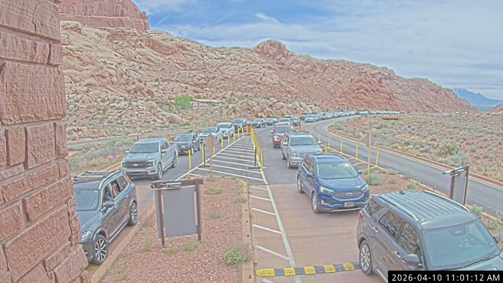 (National Park Service) Traffic backs up near the entrance to Arches National Park on April 10. Grand County is exploring a potential shuttle system with other stakeholders in part to address congestion at the park entrance and along Highway 191.