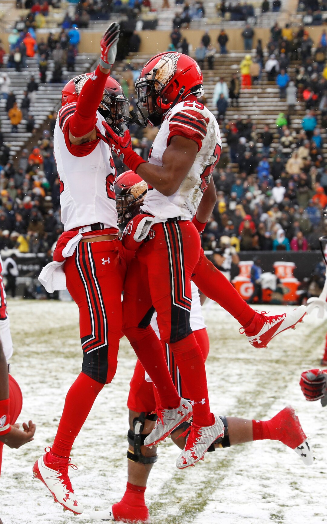 Utah wide receiver Jaylen Dixon, right, celebrates after catching a pass for a touchdown with wide receiver Solomon Enis in the second half of an NCAA college football game against Colorado, Saturday, Nov. 17, 2018, in Boulder, Colo. Utah won 30-7. (AP Photo/David Zalubowski)