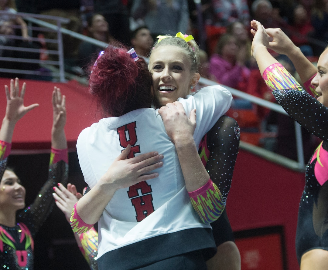 (Rick Egan  |  The Salt Lake Tribune)   Team mates congratulate MaKenna Merrell-Giles after her floor routine for Utah, in Gymnastics action Utah vs. Oregon State at the Jon M. Huntsman Center, Friday, January 19, 2018.