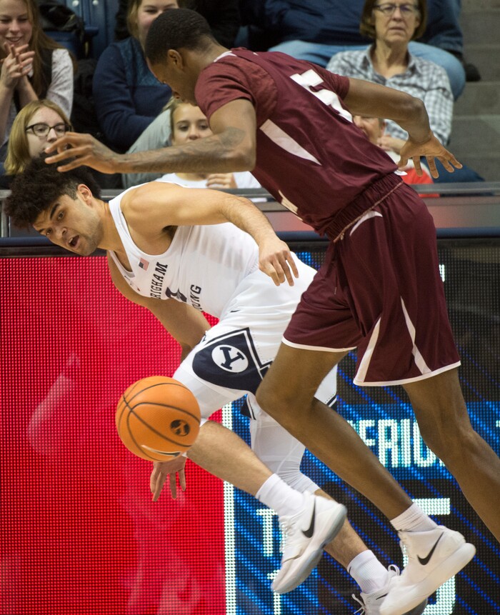 (Rick Egan  |  The Salt Lake Tribune)   Brigham Young Cougars forward Yoeli Childs (23) goes for a loose ball along with Texas Southern Tigers center Trayvon Reed (5), in basketball action, Brigham Young Cougars vs Texas Southern Tigers, at the Marriott Center in Provo, Saturday, December 23, 2017.