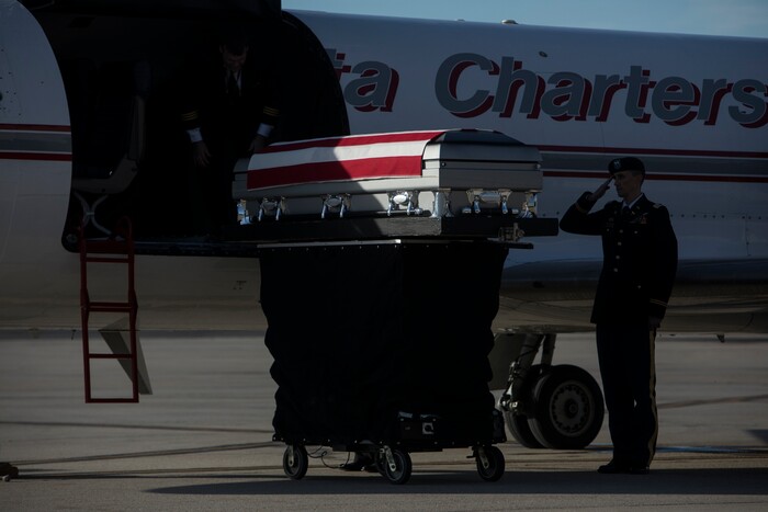 (Matt Herp | The Ogden Standrad Examiner/Pool) A casket containing the remains of Maj. Brent R. Taylor is transported off an aircraft before being placed in an hearse at Roland R. Wright Air National Guard Base in Salt Lake City, Utah, on Wednesday, Nov. 14, 2018. Taylor, 39, of North Ogden, died Nov. 3, 2018, in Afghanistan of wounds sustained from small arms fire. His funeral is scheduled for Saturday, Nov. 17, in Ogden.
