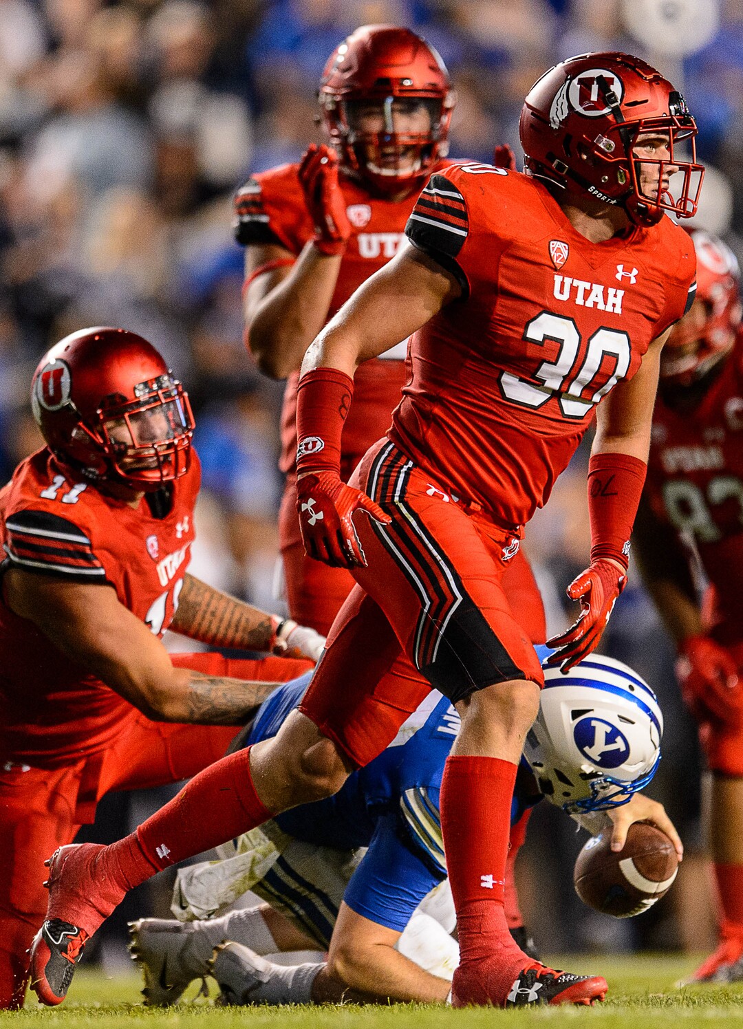 (Trent Nelson | The Salt Lake Tribune)  Utah Utes linebacker Cody Barton (30) sacks Brigham Young Cougars quarterback Tanner Mangum (12) as BYU hosts Utah, NCAA football in Provo, Saturday September 9, 2017.