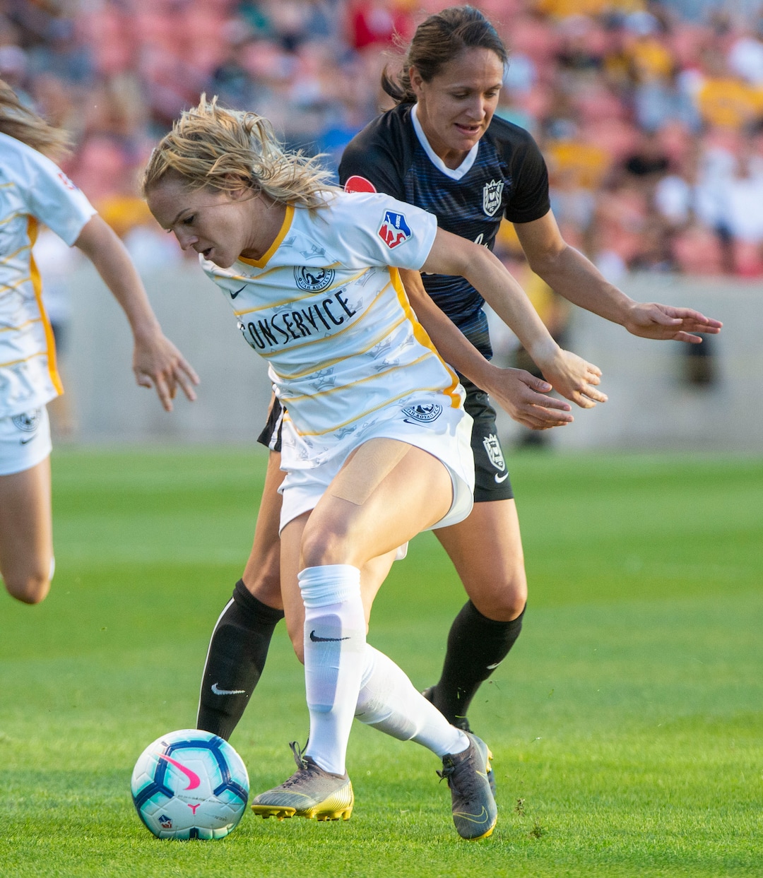(Rick Egan  |  The Salt Lake Tribune)   Seattle Reign FC defender Theresa Nielsen (8) goes for the ball along with Seattle Reign FC defender Steph Cox, in soccer action between Utah Royals FC and Seattle Reign FC in Sandy, Friday, June 28, 2019.