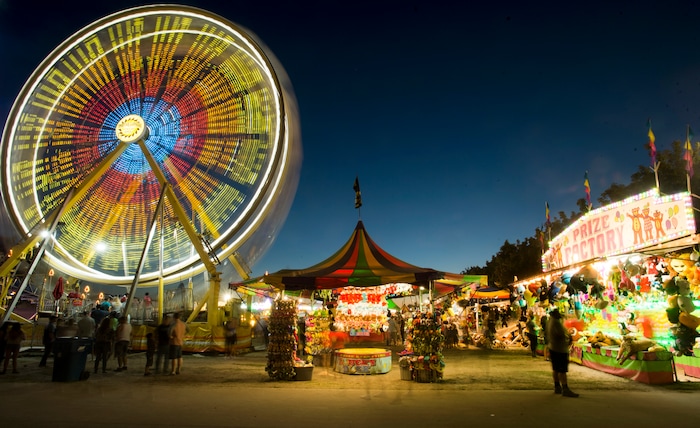 (Rick Egan  |  The Salt Lake Tribune)  The Midway glows at night at the Utah State Fair,  Monday, September 11, 2017.


