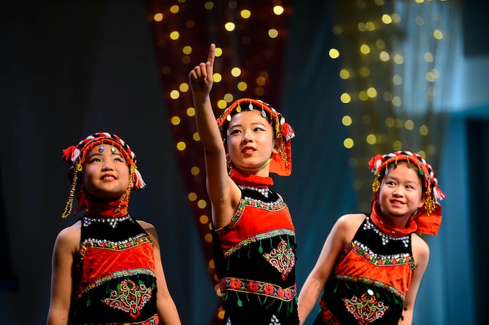 (Trent Nelson | The Salt Lake Tribune)  Cynthia Zhang, Sophia Cheng, and Yilan Fu, dancers from Jingjing's Dance Studio, perform at the Chinese New Year Celebration at the County Library's Viridian Event Center in West Jordan, Saturday Feb. 17, 2018.