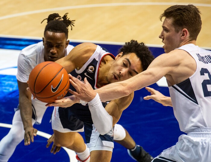 (Rick Egan | The Salt Lake Tribune)  Brigham Young Cougars guard Brandon Averette (4),and Brigham Young Cougars guard Spencer Johnson (20) double-team Gonzaga Bulldogs guard Andrew Nembhard (3), in West Coast Conference Basketball action between the Brigham Young Cougars and the Gonzaga Bulldogs at the Marriott Center in Provo, on Monday, Feb. 8, 2021.