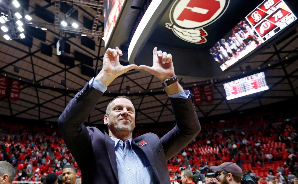 FILE - In this Feb. 8, 2018, file photo, Utah coach Larry Krystkowiak celebrates after the team's NCAA college basketball game against Stanford in Salt Lake City. Krystkowiak was selected as the AP Pac-12 conference coach of the year on Tuesday, March 6, 2018. (AP Photo/Rick Bowmer)