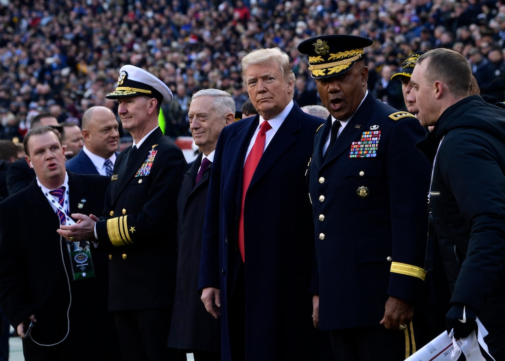 (Susan Walsh | Associated Press file photo) In this Dec. 8, 2018, file photo, President Donald Trump, center, stands with Defense Secretary Jim Mattis, left of Trump, during the pregame ceremonies at the Army-Navy football game in Philadelphia. As the first two years of President Donald Trump’s administration close, Republican allies still haven’t figured out how best to influence a leader who takes cues from the forces that swept him to office and seems to fear losing them above all else.