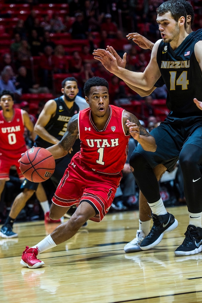 (Chris Detrick  |  The Salt Lake Tribune)  Utah Utes guard Justin Bibbins (1) runs past Missouri Tigers forward Reed Nikko (14) during the game at the Jon M. Huntsman Center Thursday, November 16, 2017.   