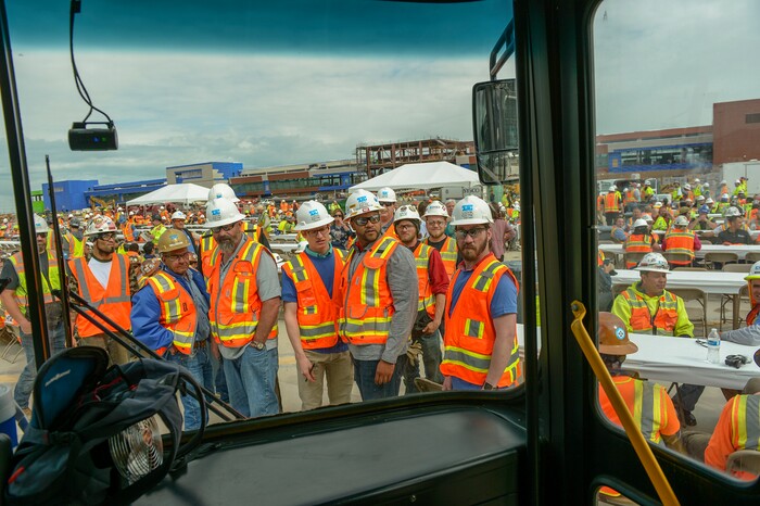 (Leah Hogsten  |  The Salt Lake Tribune) Thousands of workers from various trades attended Wednesday's "topping out" ceremony to raise the last steel beams to a high point on the new Salt Lake City International Airport terminal building, Wednesday, May 23, 2018. The new $485 million terminal building will cover 866,087 square feet and used 11,000 tons of structural steel and 22 miles of steel piles. The $1.8 billion project will be built in phases and is planned to be complete in 2023.