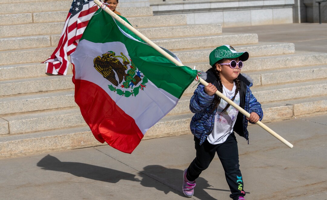 (Rick Egan | The Salt Lake Tribune)  Kendra Martinez waves a flag at the Capitol, for the national Day Without Immigrants rally, on Monday, Feb. 14, 2022.