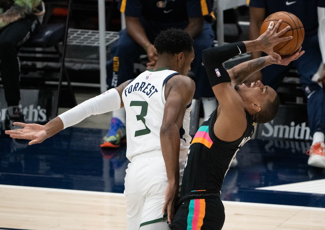 (Francisco Kjolseth | The Salt Lake Tribune) Utah Jazz guard Trent Forrest (3) fouls San Antonio Spurs guard Dejounte Murray (5) in NBA action between the Utah Jazz and the San Antonio Spurs at Vivint Smart Home Arena, on Wednesday, May 5, 2021.