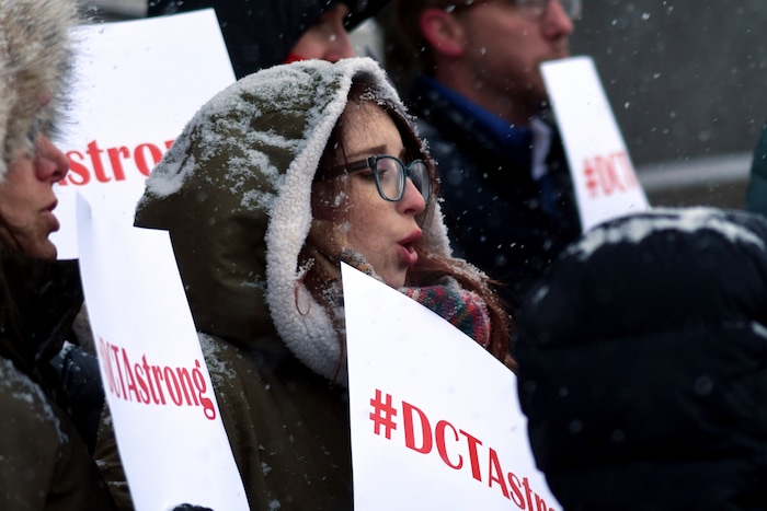 Denver teacher Rachel Davis protests outside the Colorado State Capitol on Wednesday, Feb. 6, 2019. Teachers said they plan to strike next week after state officials declined to intervene in a pay dispute between the educators and the school district. The Denver Classroom Teachers Association represents 5,635 educators in the school system. (AP Photo/Thomas Peipert)