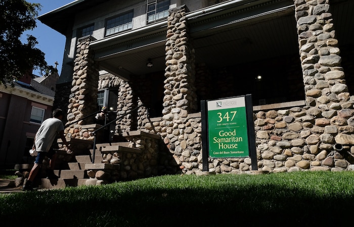 (Francisco Kjolseth  |  The Salt Lake Tribune)  Volunteers run the window at the Good Samaritan House at 347 E. South Temple where they hand out sack lunches on Tuesday, Aug. 27, 2019. After 32 years of serving sack lunches 365 days a year for 11 hours a day to Utah's poor, the Good Samaritan will be closing down, absorbed into the Catholic church's operations at St. Vincent's.