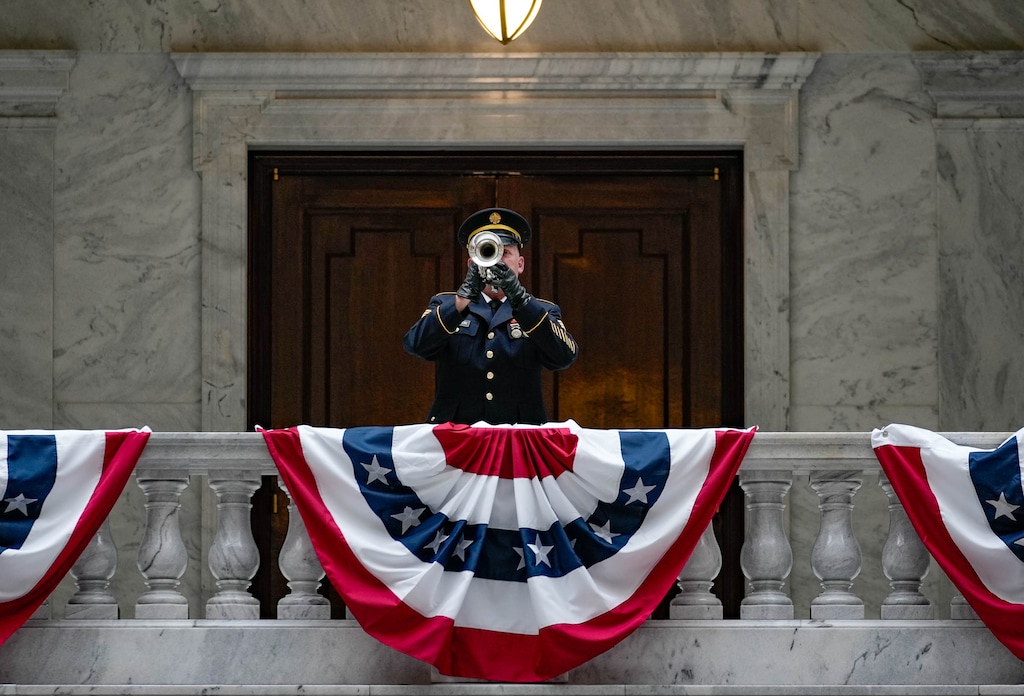 (Francisco Kjolseth | The Salt Lake Tribune) Sgt. 1st Class Morgan Davidson of the 23rd Army Band of the Utah National Guard plays taps inside the rotunda at the Utah Capitol during a Memorial Day ceremony on Monday, May 30, 2022. 