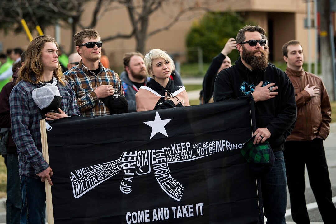 (Chris Detrick | The Salt Lake Tribune)  Participants hold signs during the March Before Our Lives rally near West High School in Salt Lake City Saturday, March 24, 2018.