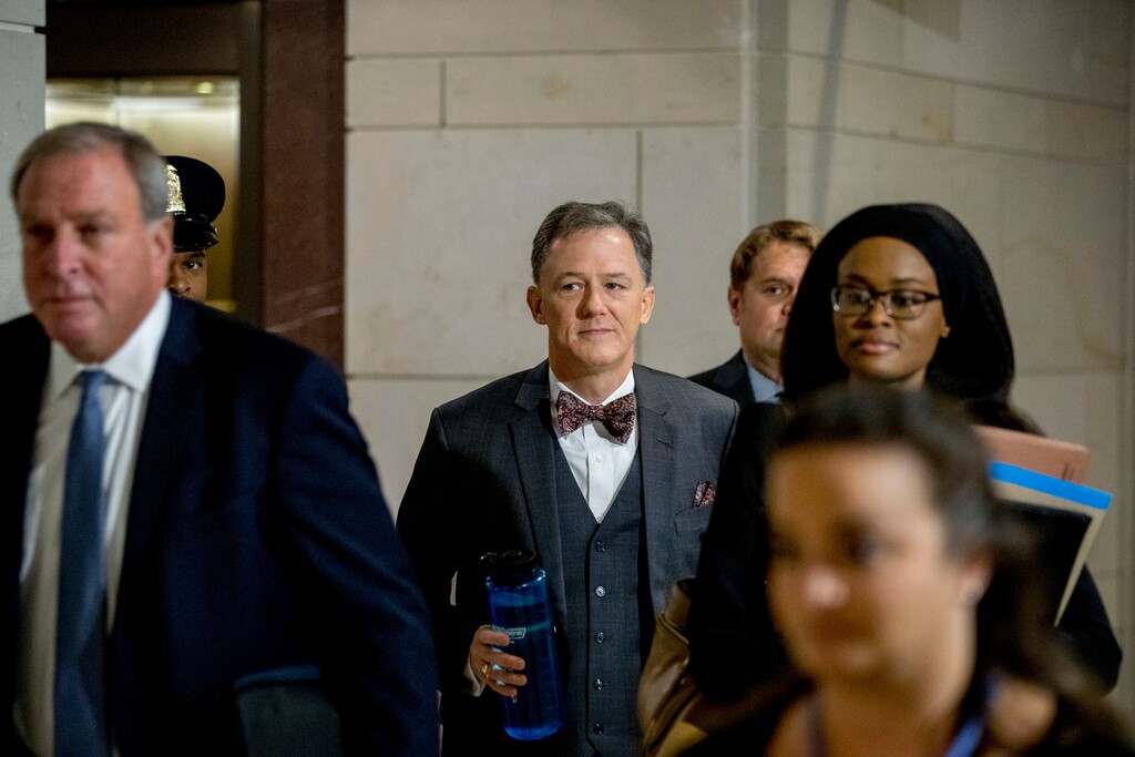 (Andrew Harnik | AP) Deputy Assistant Secretary of State George Kent, center, arrives on Capitol Hill in Washington, Tuesday, Oct. 15, 2019, as he is scheduled to testify before congressional lawmakers as part of the House impeachment inquiry into President Donald Trump.