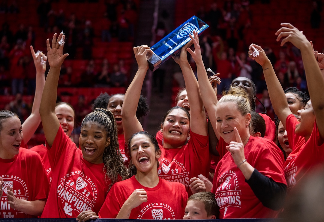 (Rick Egan | The Salt Lake Tribune) The Utes hold up the PAC-12 trophy, as they celebrate the Utes 84-78 win over the Stanford Cardinals, in PAC-12 action, at the Jon M. Huntsman Center, on Saturday, Feb. 25, 2023.