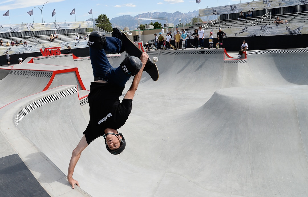 (Francisco Kjolseth  |  The Salt Lake Tribune)  Skate legend Tony Hawk delights the crowd with an invert as he joins other pro skaters for a community skate during a first look of the new Vans - Utah Sports Commission Skatepark at the Utah State Fairpark on Tuesday, Sept. 3, 2019.