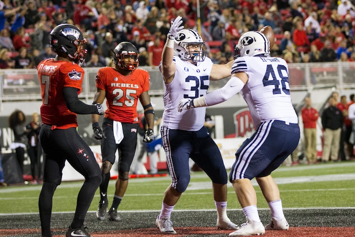 BYU running back Brayden El-Bakri (35) celebrates his touchdown against UNLV during an NCAA college football game Friday, Nov. 10, 2017, in Las Vegas. (Erik Verduzco/Las Vegas Review-Journal via AP)