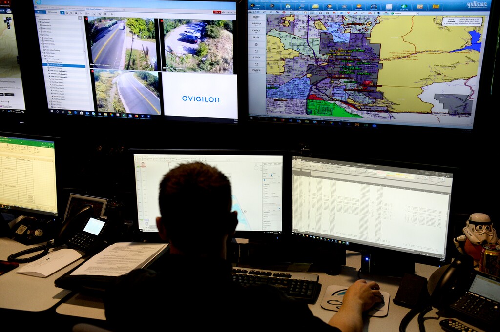 (Leah Hogsten | The Salt Lake Tribune)
Ogden Police Department detective Justin Gorman pulls together data and video footage to solve crimes in the ATAC center, October 1, 2019. Ogden Police Department's Area Tactical Analysis Center (ATAC) is staffed by three civilians and two OPD police detectives who monitor real time footage from the city's stationary and mobile cameras to assist officers on the frontline responding to crimes in progress and also detectives in the field, including from other agencies, to solve crimes.