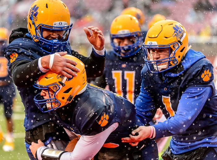 (Trent Nelson | The Salt Lake Tribune)  Orem's Cooper Legas (5) and teammates celebrate a touchdown as Orem faces Mountain Crest in the Class 4A High School State Football Championship game in Salt Lake City, Friday November 17, 2017.