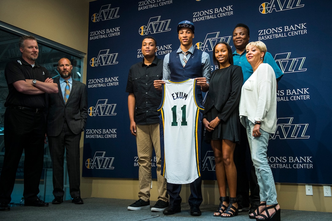 Chris Detrick  |  The Salt Lake TribuneUtah Jazz's Dante Exum poses for pictures with members of his family during a press conference at the Zions Bank Basketball Center Friday June 27, 2014. 