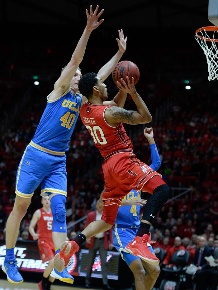 (Francisco Kjolseth  |  The Salt Lake Tribune)  Utah Utes guard Gabe Bealer (30) sails in to the basket as UCLA Bruins center Thomas Welsh (40) puts on the pressure as the University of Utah hosts UCLA in NCAA basketball at the Huntsman Center in Salt Lake City, Thursday, Feb. 22, 2018.