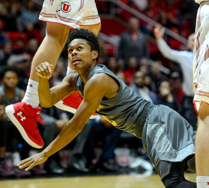(Steve Griffin  |  The Salt Lake Tribune) Arizona State Sun Devils guard Tra Holder (0) looks up at his shot as he falls tot he court during the Utah Utes versus Arizona State Sun Devils at the Huntsman Center on the University of Utah campus in Salt Lake City Sunday January 7, 2018.