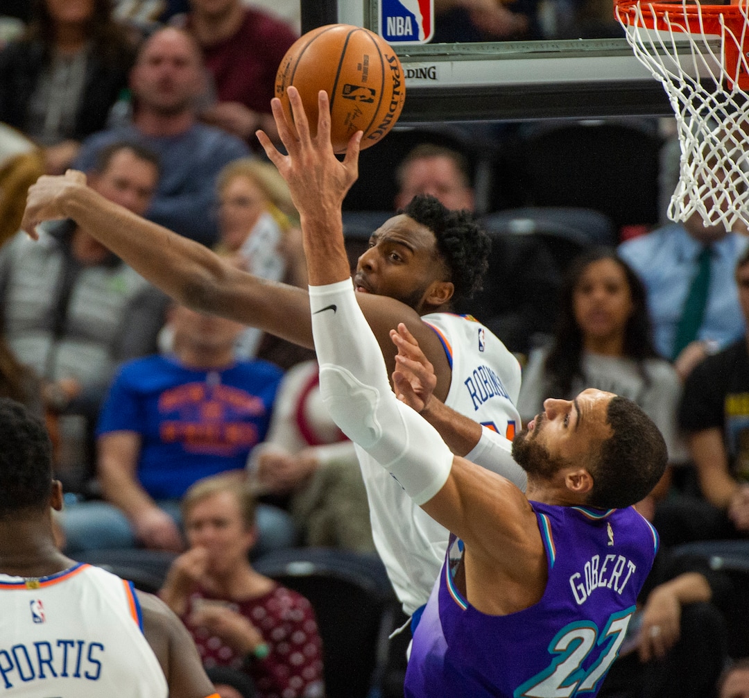 (Rick Egan  |  The Salt Lake Tribune)  Rudy Gobert (27), grabs a rebound from New York Knicks center Mitchell Robinson (23), in NBA action between the Utah Jazz and the New York Knicks, in Salt Lake City, Wednesday, Jan. 8, 2020.