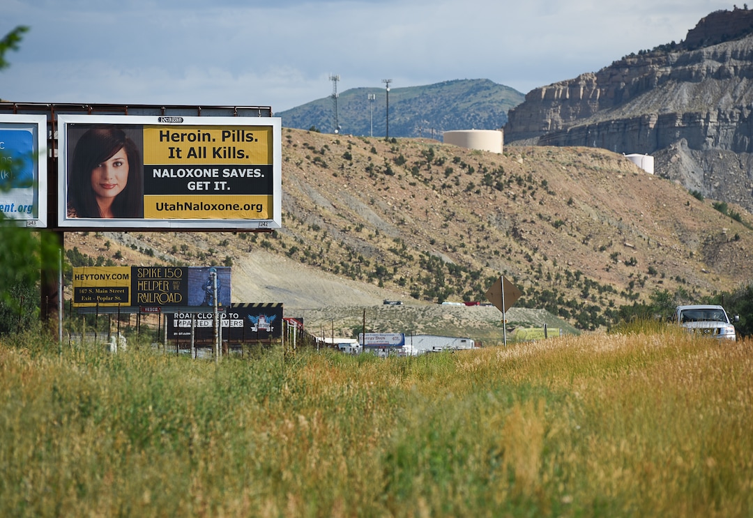 (Francisco Kjolseth | The Salt Lake Tribune)  Traffic rolls past a billboard bringing attention to the opioid crisis along U.S. Route 191 in Carbon County where at least 93 people have died to opioid overdose between 2000 and 2018, according to data from the Utah Department of Health.