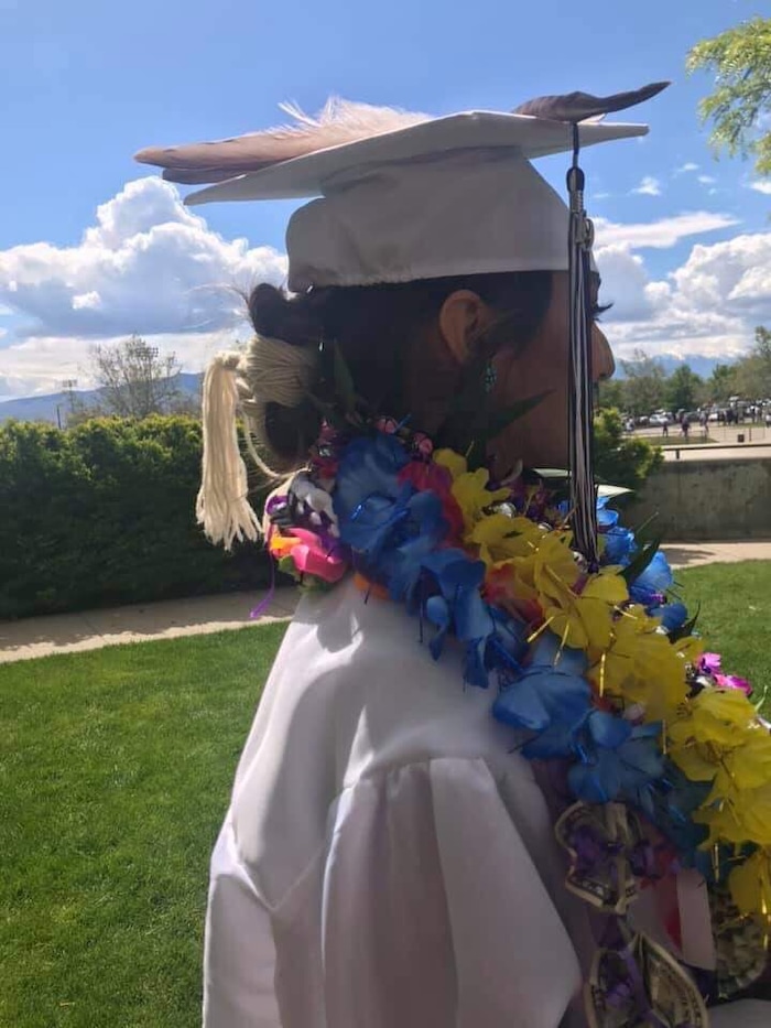 (Photo courtesy of Tasheena Savala) Pictured is Tasheena Savala with leis and decorations added after her graduation ceremony on May 29, 2019.